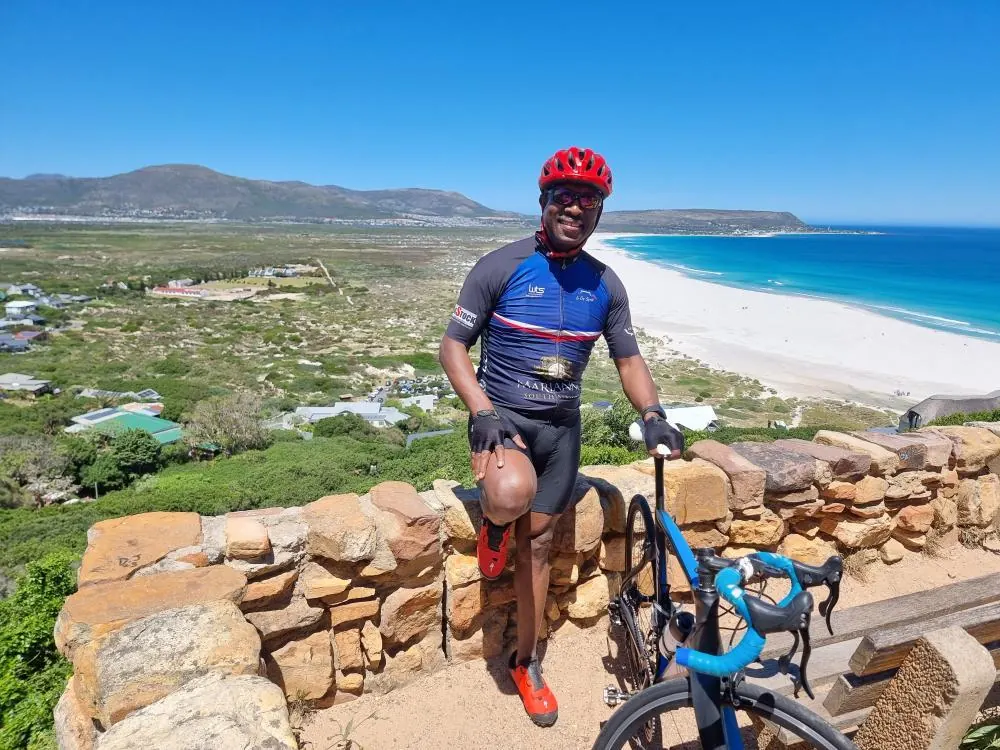 Solly Moeng with his bicycle overlooking the coastline