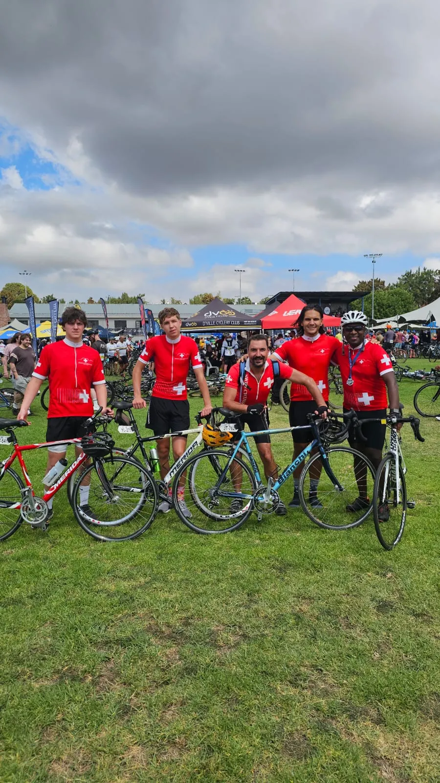 Solly Moeng with fellow cyclists at an outdoor gathering