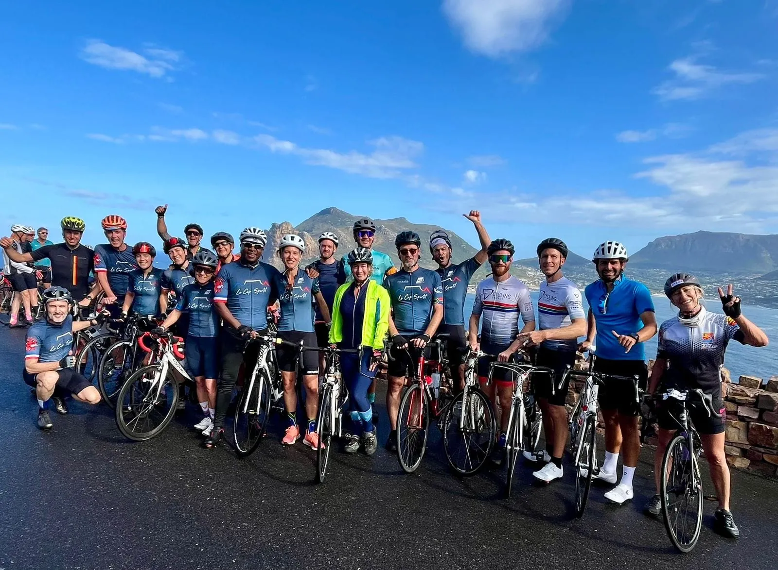 Solly Moeng with a large group of cyclists