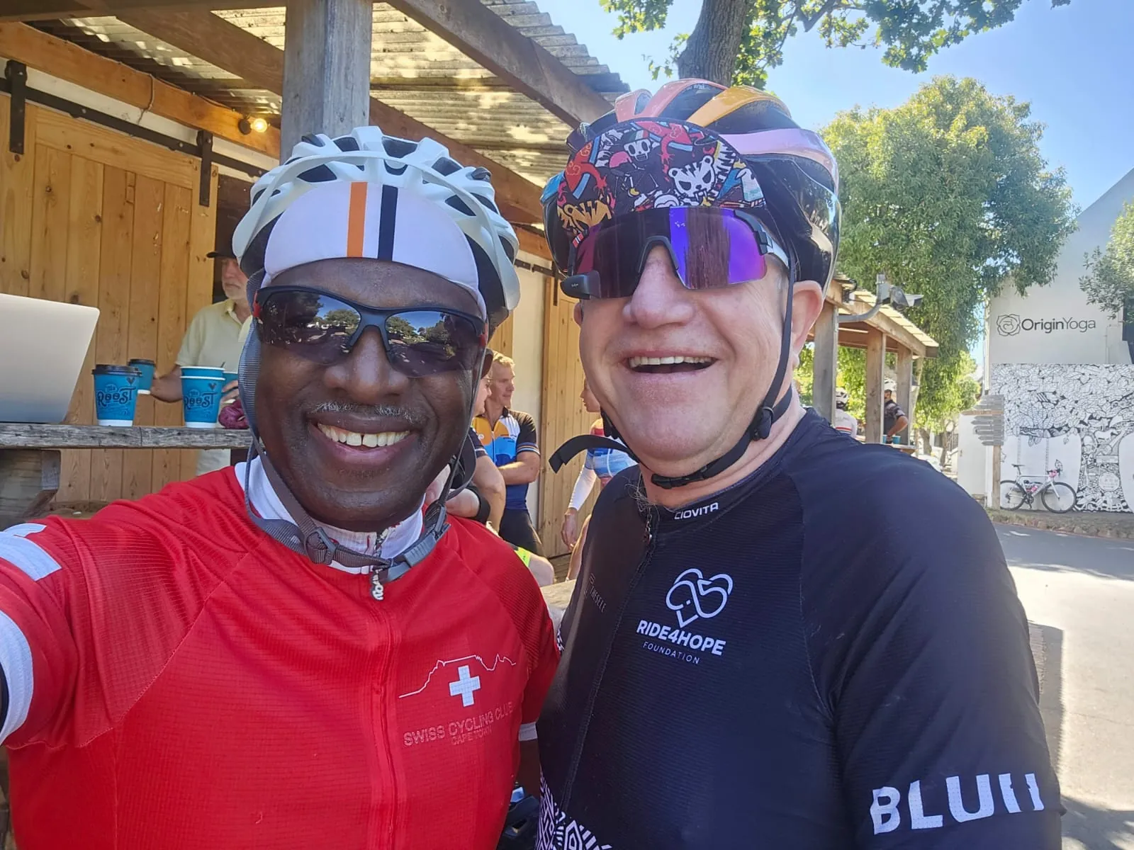Solly Moeng with a fellow cyclist at a cycling stop