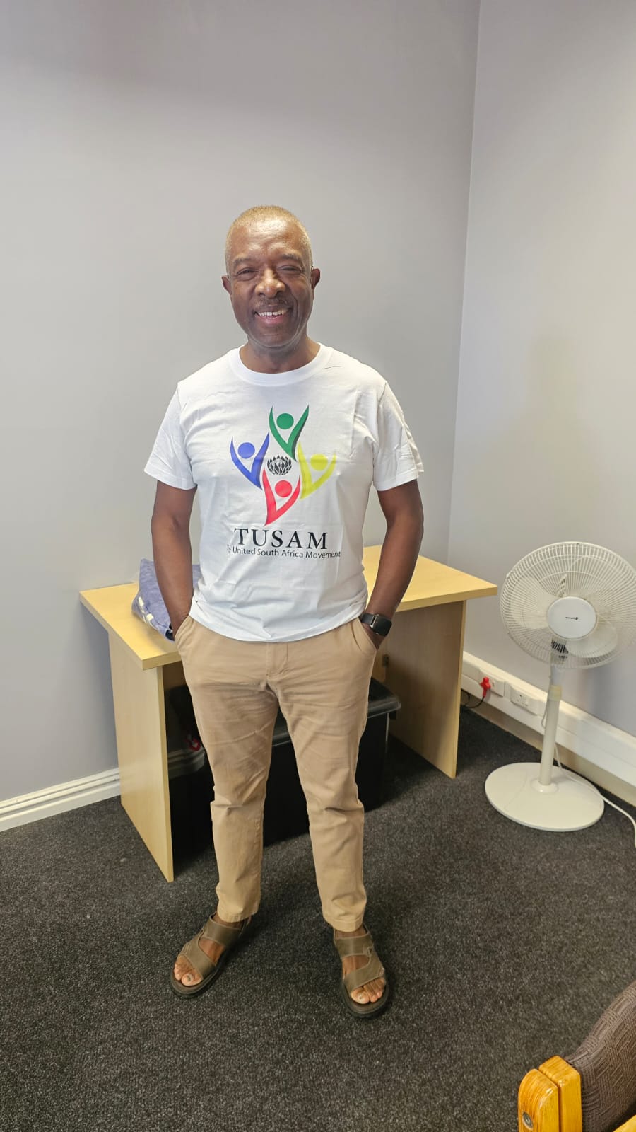 Solly Moeng wearing a TUSAM shirt